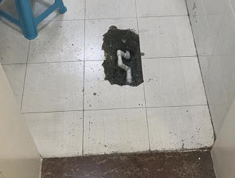 卫生间漏水到楼下怎么处理？快速止损与维修方案指南